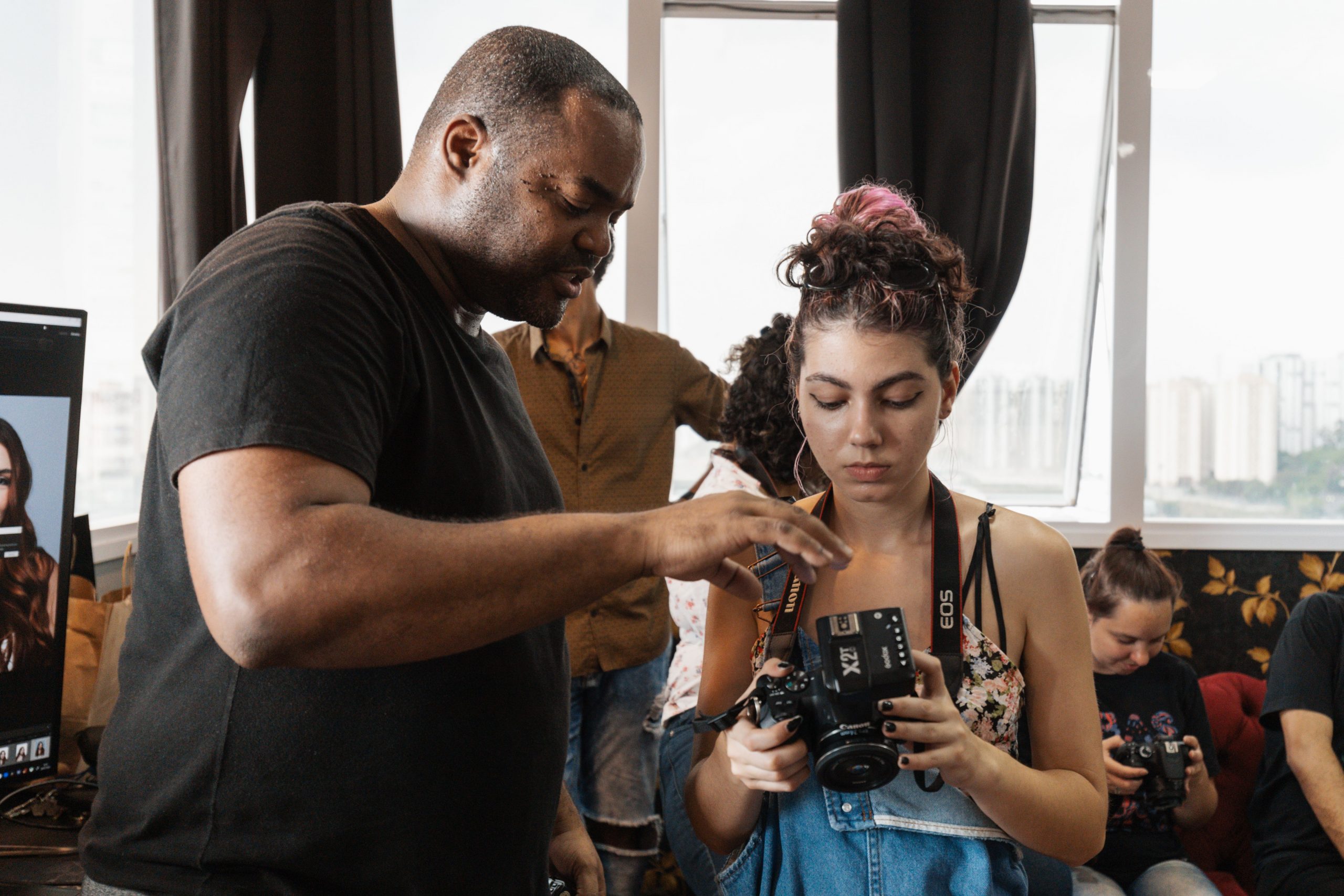 Beginner photographers learning at a Dubai workshop